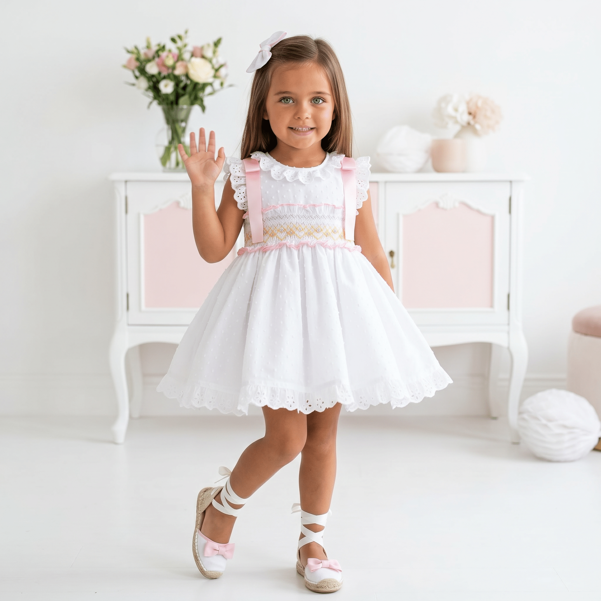 Girls Sonata white smocked Spanish dress with pink ribbon detail, broderie anglaise trims and full skirt