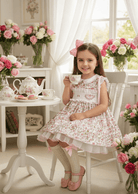 Shop the Sonata girls heart smocked floral dress from the SS26 collection. Traditional puffball style perfect for Easter and occasions.