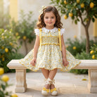 Sonata smocked girls dress in yellow floral print for SS26