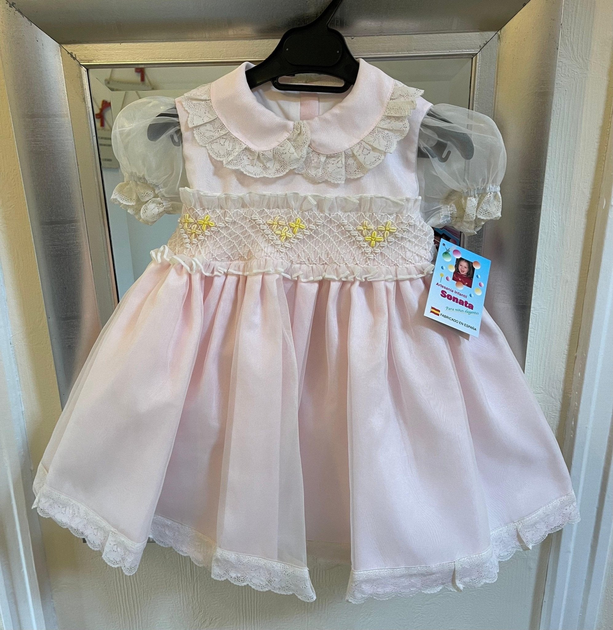 Sonata Girl's pink, cream, and lemon smocked dress handmade in Spain 
